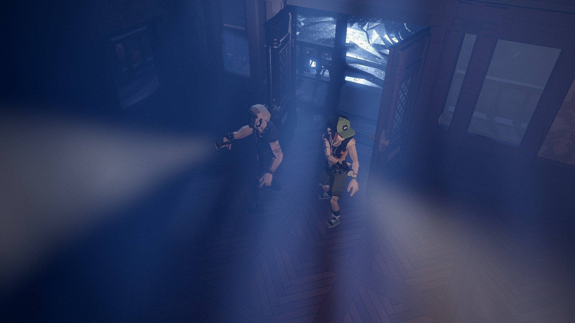 Burglars sneaking through a dark hallway